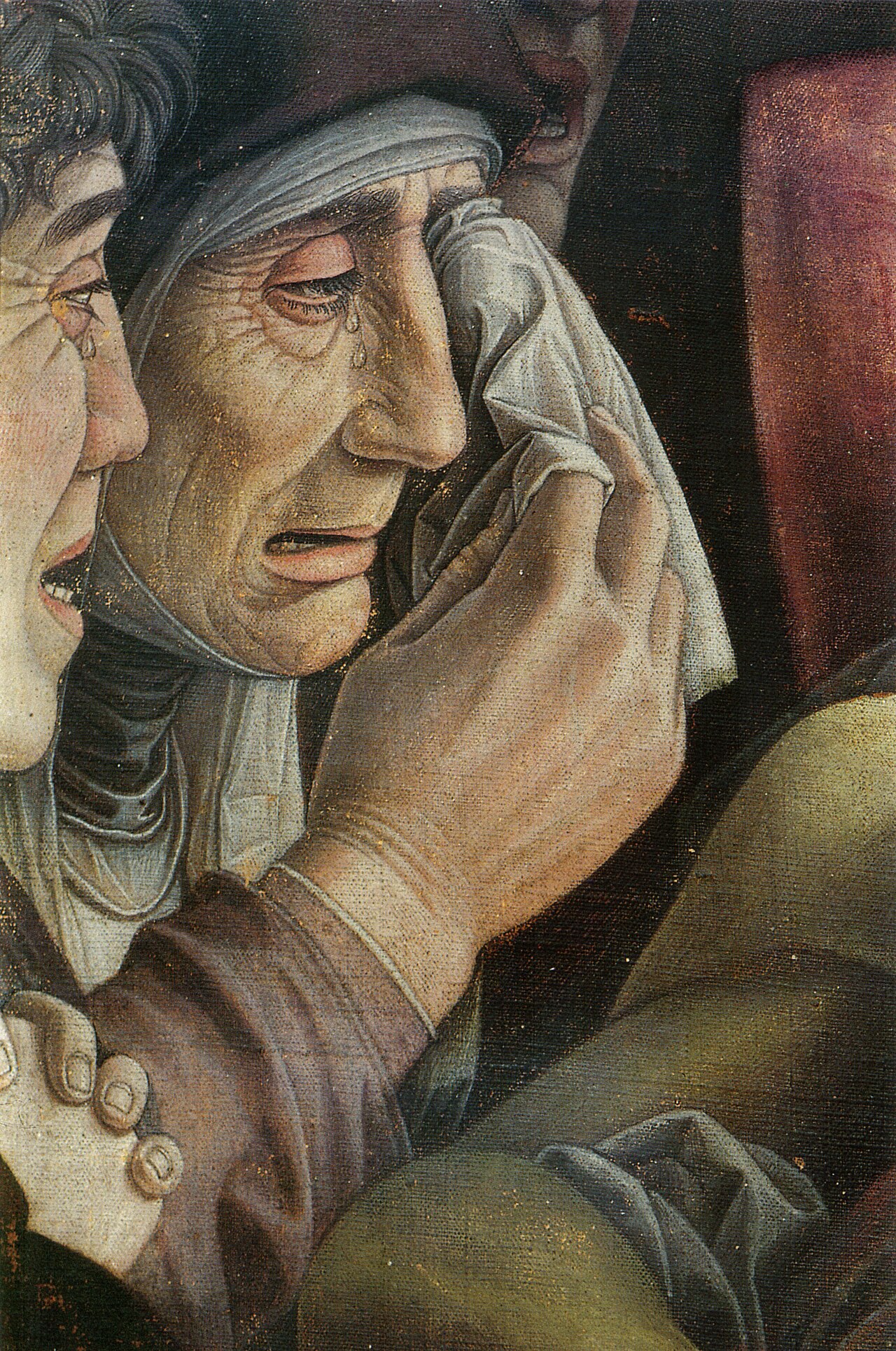 Dettaglio del Cristo morto di Mantegna: la Vergine anziana si asciuga le lacrime con un fazzoletto accanto a san Giovanni